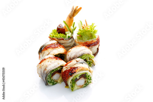 Unagi ebi ten roll, isolated on white, with a copy-space. A packshot photo for sushi restaurant menu. 6 piece sushi set with eel, shrimp in tempura, cucumber, on a white background. photo