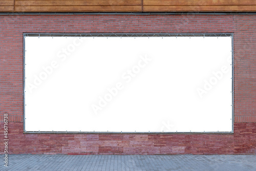 Empty wide tarpaulin billboard mockup on brick wall photo