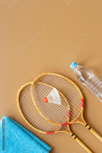 Sports equipment with badminton rackets towel and water