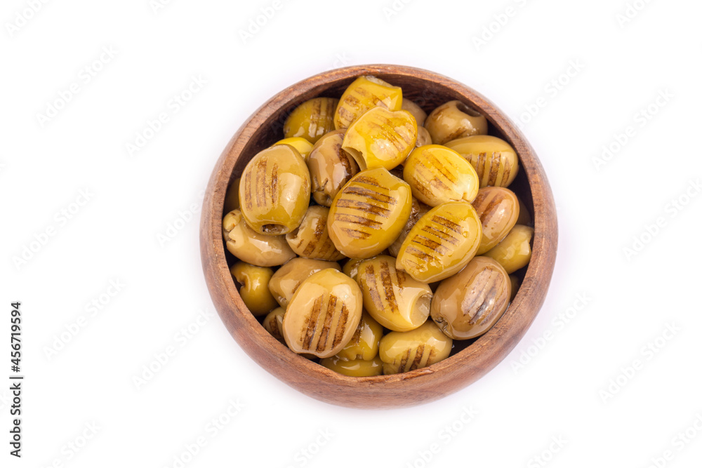 Grilled green olives. Tasty organic green olives in the plate. Grilled green olives. Tasty organic green olives in the plate.