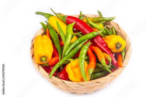 Colorful hot peppers on wooden background