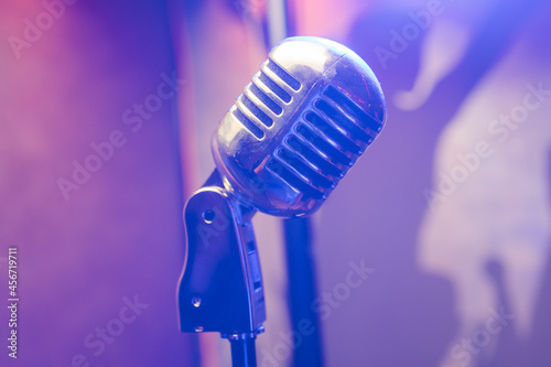 Photography Retro microphone on stage in a pub or American Bar restaurant during a night show