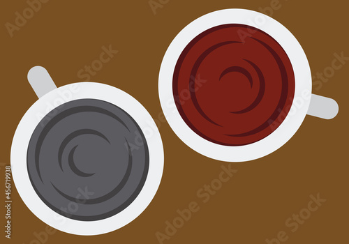 Dos cafés en una mesa vistos desde arriba.