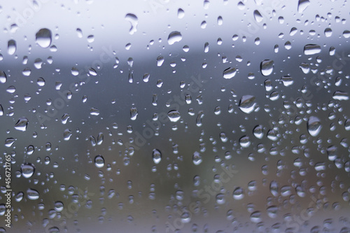 Defocused abstract background of raindrops on windshield car after rain