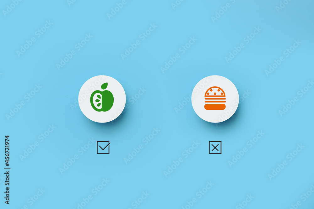 Paper circles with drawings of harmful and healthy food. Choosing vegetables among fast food
Paper circles with drawings of harmful and healthy food. Choosing vegetables among fast food