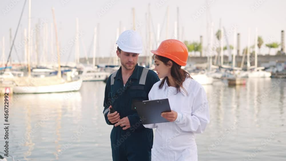 Yacht club worker talking with port state inspector Yacht club worker talking with port state inspector