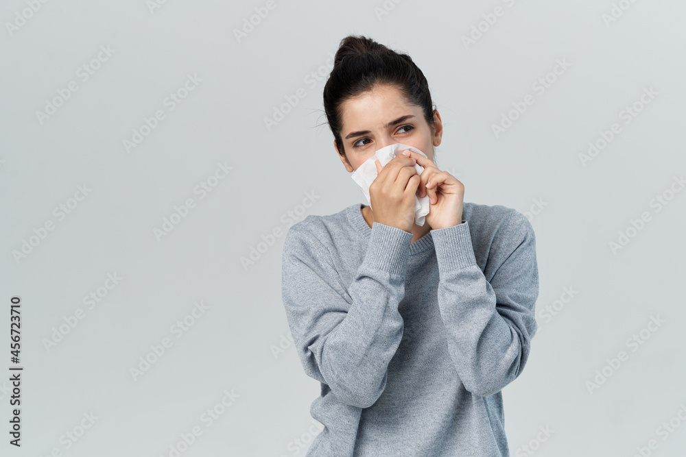 woman wipes her nose with a handkerchief infection allergy runny nose woman wipes her nose with a handkerchief infection allergy runny nose