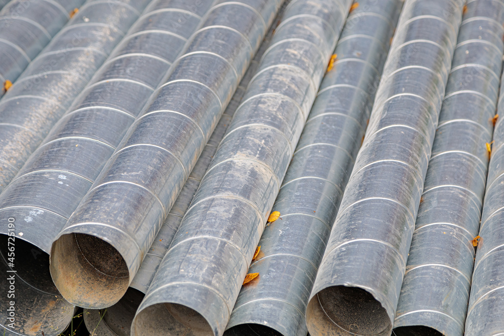 Metal pipes for ventilation on a construction site. Ventilation pipes. Metal pipes for ventilation on a construction site. Ventilation pipes.