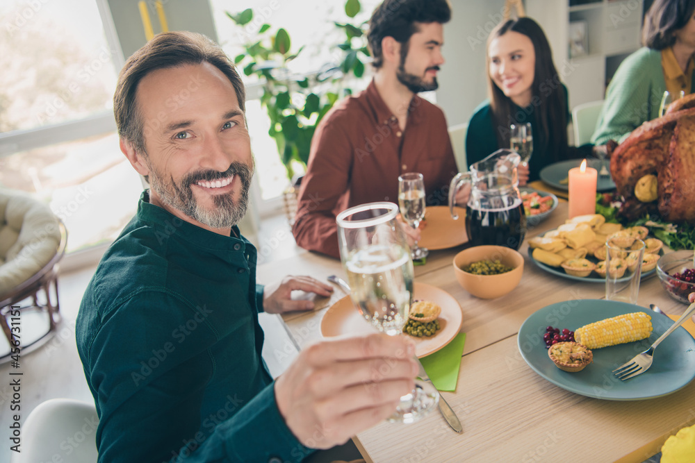 Portrait of adorable cheerful family eating homemade dish celebrating festal occasion event party at home indoors