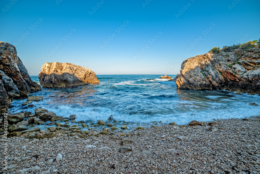 Tiny nudist beach between the rocks