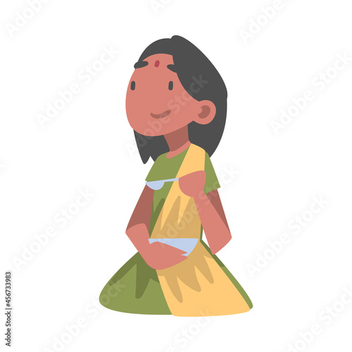 Indian Little Girl Wearing Sari with Bindi Sitting on the Floor with Bowl Having Meal Vector Illustration © topvectors