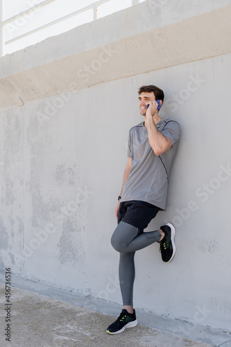 athlete boy talking on the mobile phone