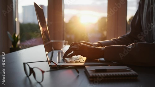 Businessman using laptop computer in office. Young man student working at home. Online learning,  internet marketing, business studying, working from home, online education, web conferencing concept.