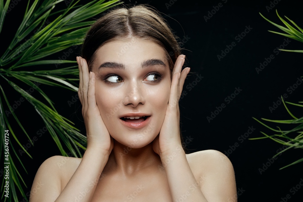 woman touching face with hands brunette makeup model naked shoulders woman touching face with hands brunette makeup model naked shoulders