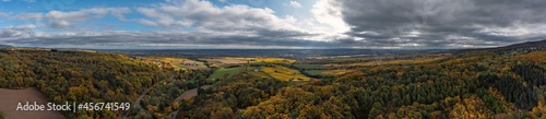 Bird s eye view of a forest in the Taunus - Germany with a cloudy sky