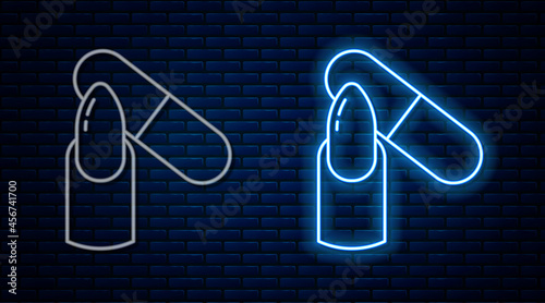 Glowing neon line Nail file icon isolated on brick wall background. Manicure tool. Vector