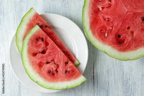 Waterelon, honey watermelon on wooden table background. photo