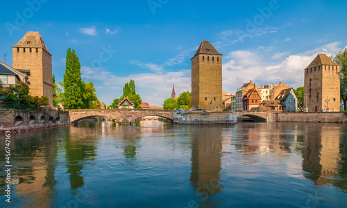 Lovely panorama of the famous Ponts Couverts, a set of bridges and towers that make up a defensive work erected in the 13th century on the River Ill in the city of Strasbourg, France on a sunny day.