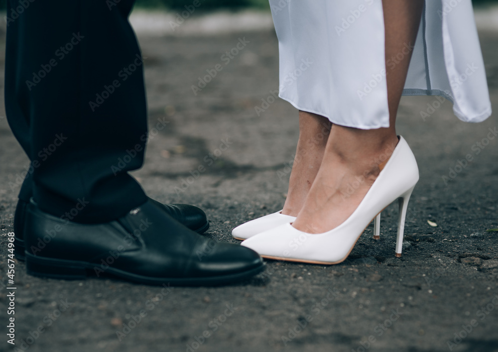 bride and groom. shoes. kiss of a young couple. wedding day