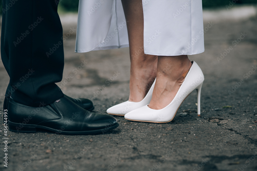 bride and groom. shoes. kiss of a young couple. wedding day