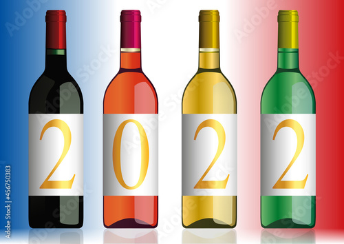Présentation originale du millésime 2022 avec l’année inscrite sur quatre bouteilles de vins de Bordeaux de différentes couleurs.