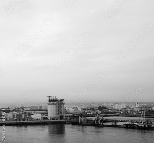Coastal industrial district buildings skyline with moody sky at Hakodate port in Hokkaido, Japan