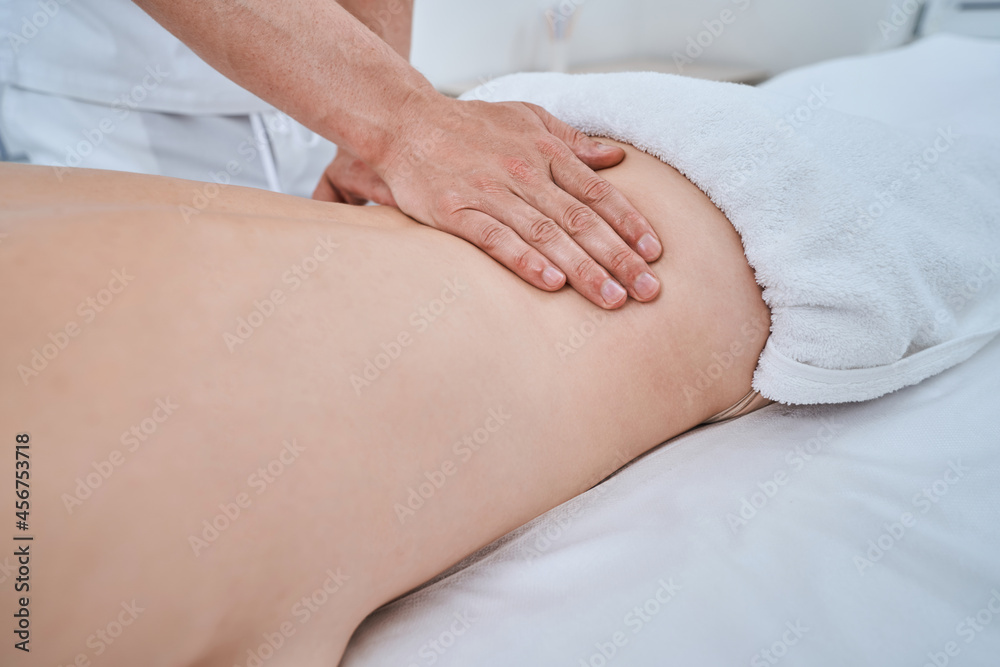 Female patient getting a therapeutic massage for lumbalgia