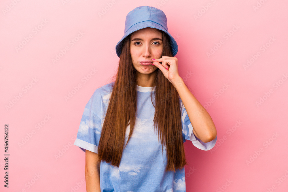 Young caucasian woman isolated on pink background with fingers on lips keeping a secret. Young caucasian woman isolated on pink background with fingers on lips keeping a secret.