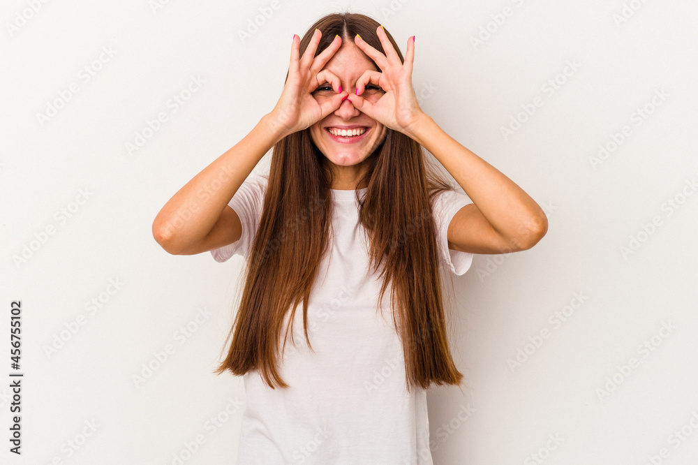 Young caucasian woman isolated on white background excited keeping ok gesture on eye. Young caucasian woman isolated on white background excited keeping ok gesture on eye.
