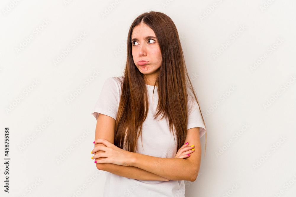 Young caucasian woman isolated on white background tired of a repetitive task. Young caucasian woman isolated on white background tired of a repetitive task.