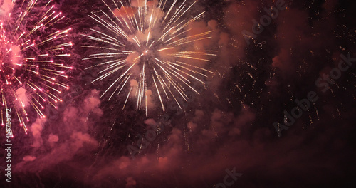 Firework celebrate anniversary happy new year 2022, 4th of july holiday festival. colorful firework in the night time to celebrate national holiday. countdown to new year 2022 party time event.