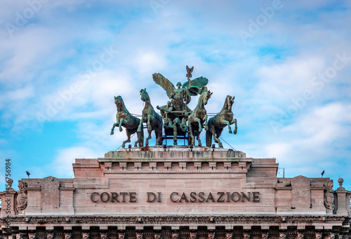 The great bronze quadriga, above the facade of the Palace of Justice in Rome, Italy. Set there in 1926, it's the work of the Sicilian sculptor Ettore Ximenes. photo