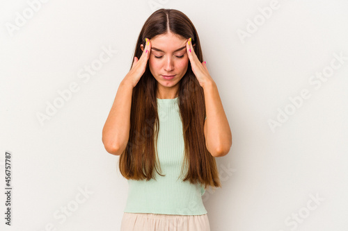 Young caucasian woman isolated on white background touching temples and having headache.