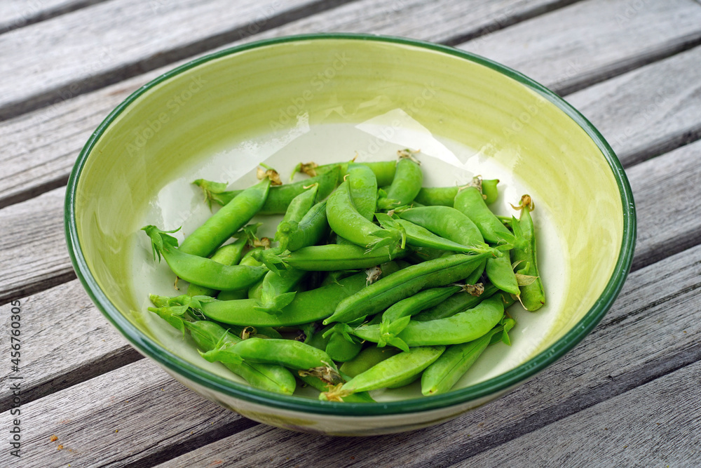 Bowl of freshly picked green garden peas Bowl of freshly picked green garden peas