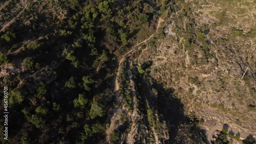 aerial video of mountain bikers on dirt road