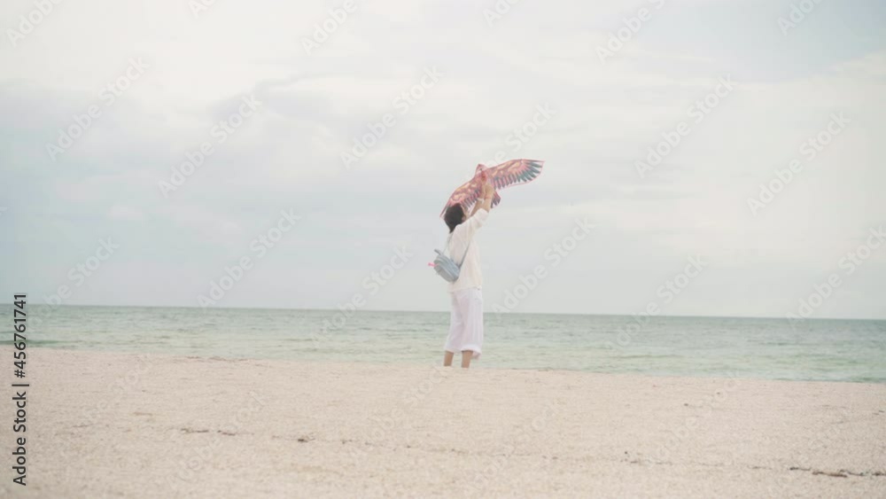 Mother with Little Daughter Dressed White Clothes Playing Kite Sea Beach Happy Caucasian Family With One Child Have Fun Summer Vacation Sea Shore. Active Leisure Positive Emotions Happy Childhood Mother with Little Daughter Dressed White Clothes Playing Kite Sea Beach Happy Caucasian Family With One Child Have Fun Summer Vacation Sea Shore. Active Leisure Positive Emotions Happy Childhood