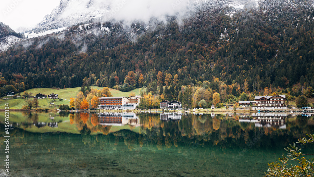 Reflections and autumn colors on Lake Hintersee in southern Germany 