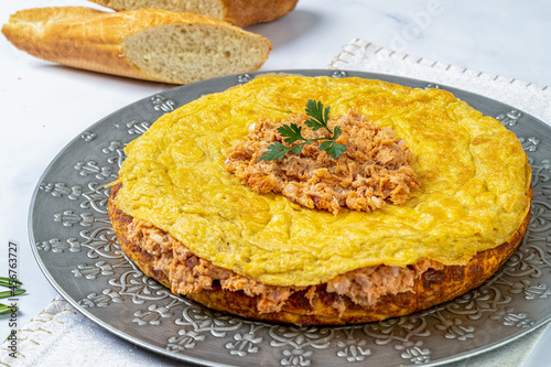 Typical Spanish tortilla with tuna in marble table