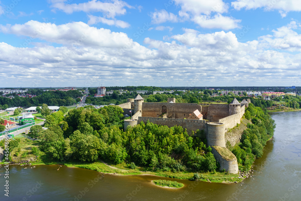 Medieval castle on the border of Russia and Estonia by the river.