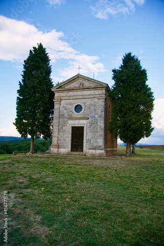 Famous Tuscan church with two cypress trees