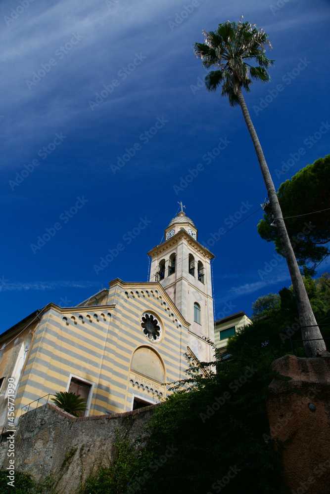 Portofino's famous church with a palm tree