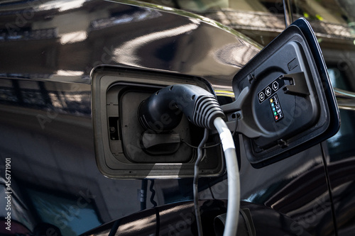 Detail of electric car charging at a charging point