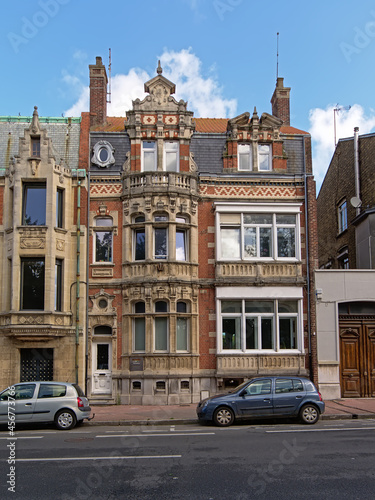Historical decorated house in Flemish renaissance or baroque style in a street in Calais, France