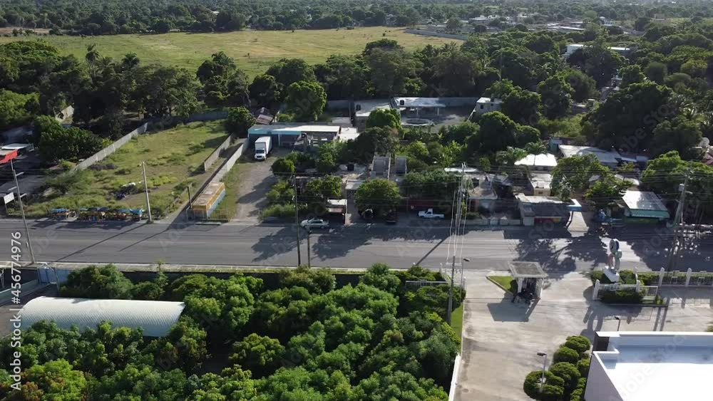 panoramic view of the road to bani, dominican republic, light traffic of commercial cars, rural area. panoramic view of the road to bani, dominican republic, light traffic of commercial cars, rural area.