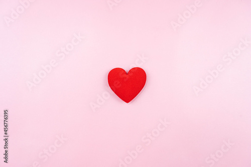 mini red heart on pink background