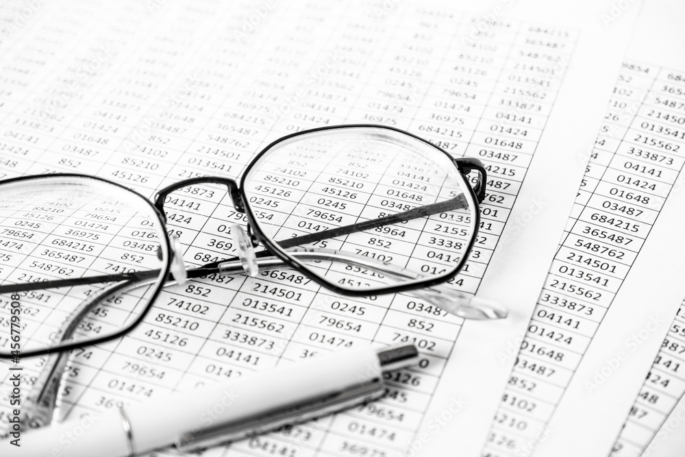 Financial Image Of Some Tax Forms With Glasses And A Pen. Business concept. Accounting report, estimate. Financial Image Of Some Tax Forms With Glasses And A Pen. Business concept. Accounting report, estimate.