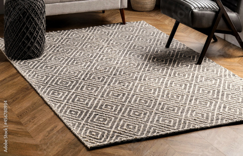 Modern grey geometric floor living area rug and interior room rug texture design. photo