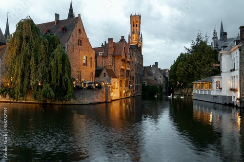 Bruges, Belgium. September 30, 2019: Dock of the rosary and reflections in the water of the lights.