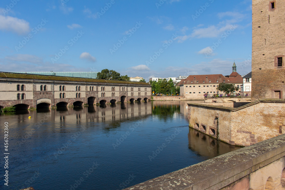Beautiful view of the Barrage Vauban, a defensive city dam structure on the Ill River (also called the Grande Écluse), in the city of Strasbourg, France.
