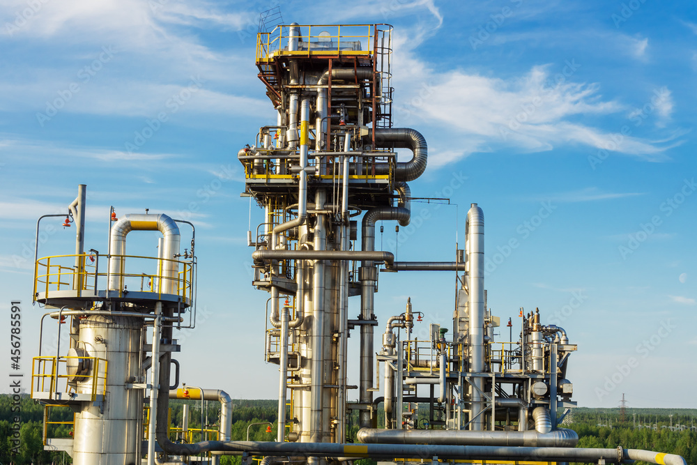 View of the absorption distillation column of gas liquefaction in summer. View of the absorption distillation column of gas liquefaction in summer.